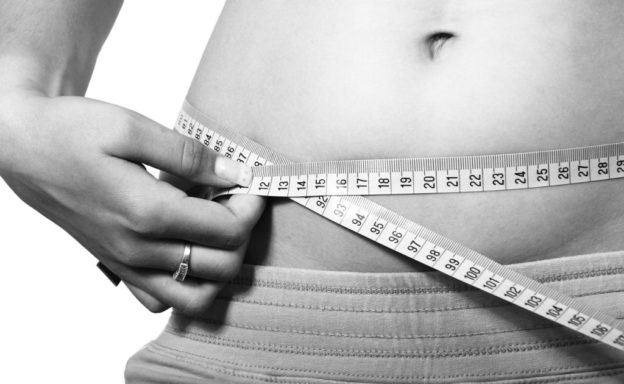 measuring the waist using a tape measure